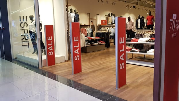Ukraine, Kiev - September 04, 2019. Sale signs in a shop window in a shopping center on the day of shopping and the international holiday Black Friday, sale and discounts in clothing boutiques.