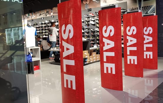 Ukraine, Kiev - September 04, 2019. Sale signs in a shop window in a shopping center on the day of shopping and the international holiday Black Friday, sale and discounts in clothing boutiques.