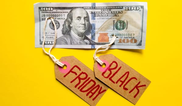 Black friday background, friday black text with money on a yellow background, copy space for text. Black friday sale text written on a notepad with a red pencil on a red background. Background, holiday concept. Black Friday - International day of shopping, promotions, discounts, sales. The sales season is the fourth Thursday of November. Copy space, place for text, flat lay.