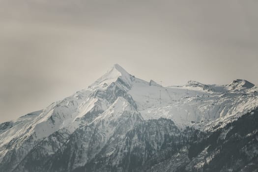 Snowy Kitzsteinhorn in winter, ski lift, Austria