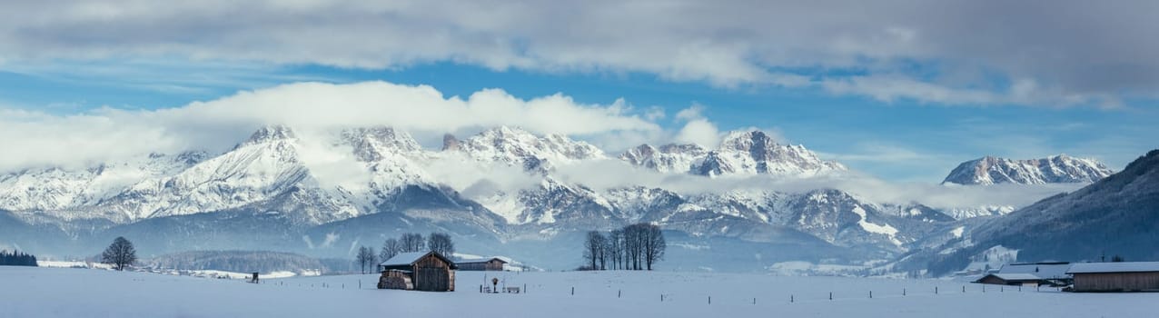 Snowy mountains, meadow and a hut, landscape in Austria, panorama