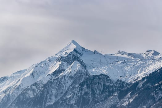 Snowy Kitzsteinhorn in winter, ski lift, Austria