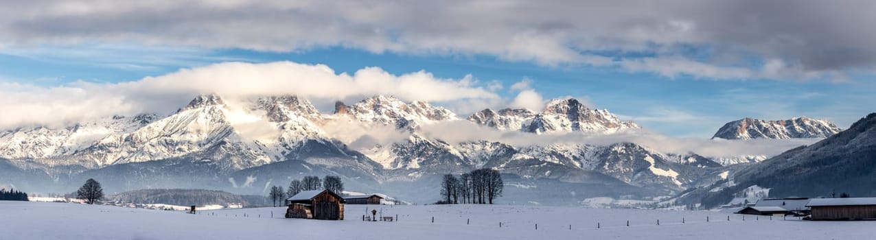 Snowy mountains, meadow and a hut, landscape in Austria, panorama