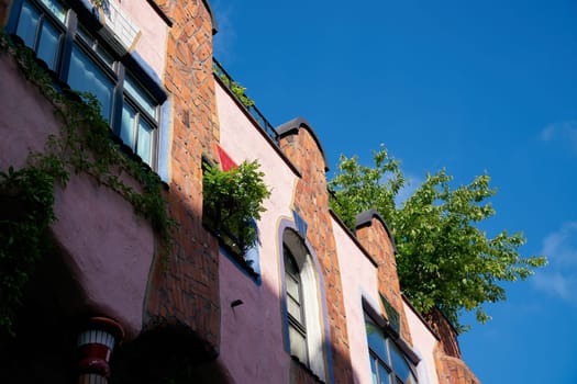 Facade of the Hundertwasserhaus, called "gruene Zitadelle"" in the city center of Magdeburg in Germany"