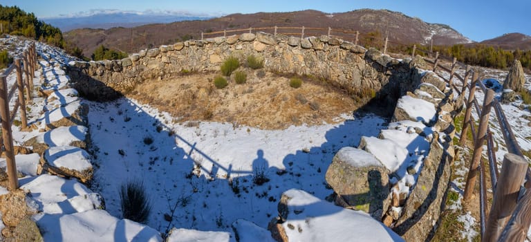 Visitor shadow at old Corral de Lobos or Wolves trap. La Garganta, Extremadura, Spain