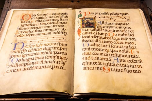 TURIN, ITALY - CIRCA MAY 2021: antique Medieval manuscript with ancient calligraphy.