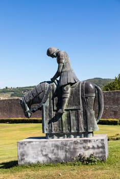 Assisi village in Umbria region, Italy. Statue of St. Francis. The town is famous for the most important Italian St. Francis Basilica (Basilica di San Francesco)