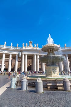 ROME, VATICAN STATE - AUGUST 24, 2018: long line of people waiting in front of Saint Peter Basilica entrance. Concept for overtourism and mass-tourism.