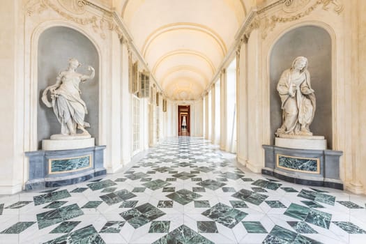 VENARIA REALE, ITALY - CIRCA MAY 2021: corridor with floor made of luxury marbles. Plenty of elegance for this Italian interior in Venaria Reale, Piedmont region.