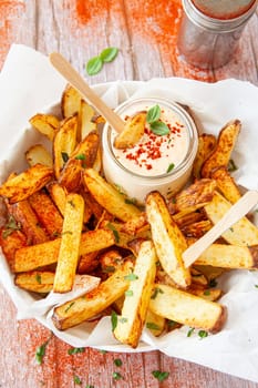 Homemade French fries, potato weddges with garlic dip