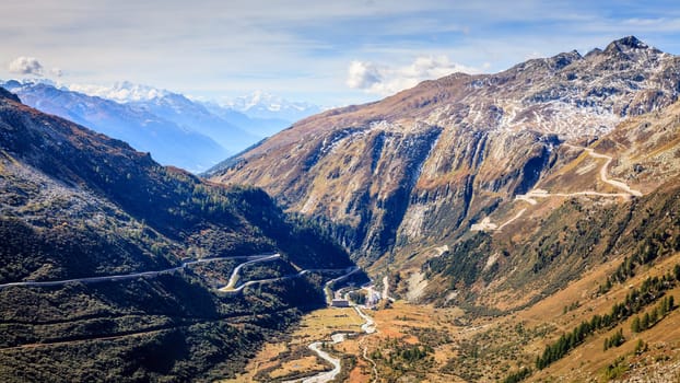 Scenic view of a switchback road through the mountains in Switzerland