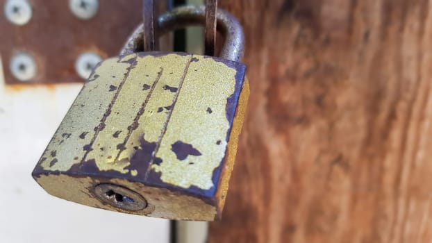 metal door with lock, texture and background. Background texture of an iron padlock on a rusty metal gate