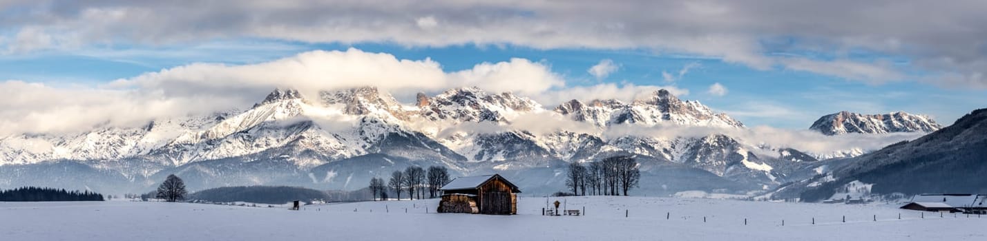 Snowy mountains, meadow and a hut, landscape in Austria, panorama