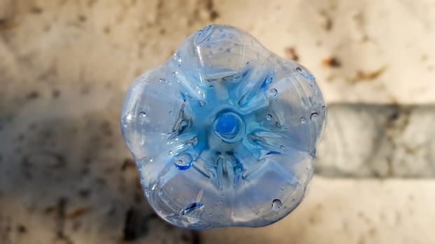 The bottle is plastic. Ecology, plastic pollution. Ocean pollution. Plastic in the sand. Trash on the beach concept. artificial pollution and poster. World Promotion Week. We clean the world. We clean the planet from debris.