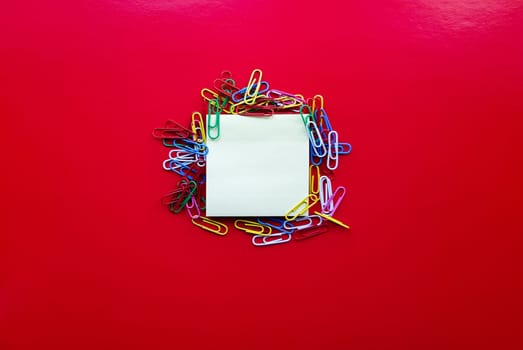 yellow sheet of paper for notes and paper clip.