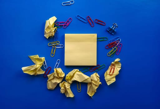 yellow sheet of paper for notes and paper clip.