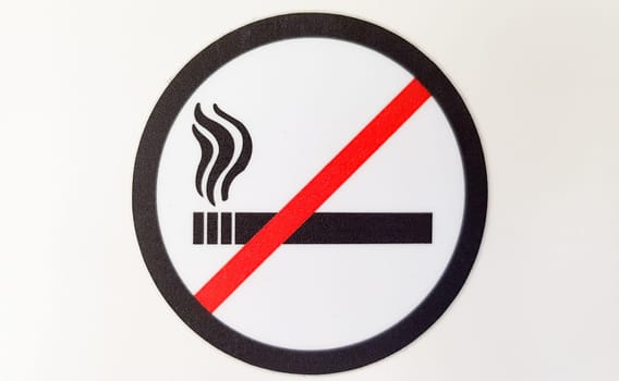 Round red and black no smoking sign, sticker in a public place on a white background.