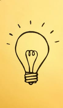 light bulb icon representing ideas, creativity and innovation in a colorful yellow banner background