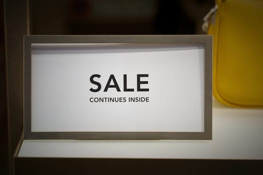 Sign in a shop window in Berlin with the words Sale continues inside