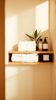 Spa treatment set, wooden shelf with neatly folded towels and dispensers for soap, cream, massage oil. High quality photo
