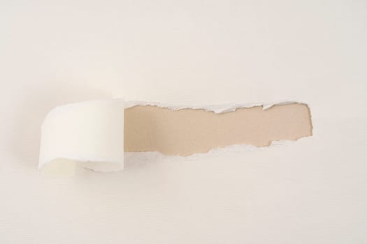 a strip torn from a cardboard that leaves room for an inscription