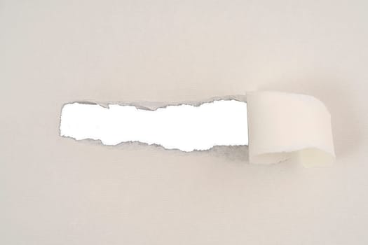 a strip torn from a cardboard that leaves room for an inscription