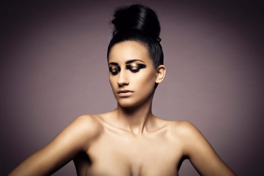 Beauty portrait of young sexy woman against purple background