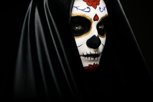 Portrait of a girl with sugar skull makeup. Calavera Catrina. Dia de los muertos. Day of The Dead. Halloween.