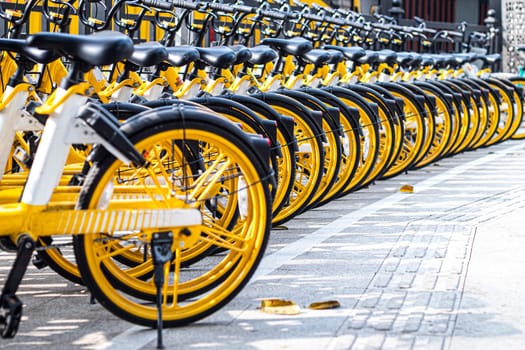 December 2019 Guangzhou china rental bikes found along the main street to serve public and connect from area to other. Bicycle parking sign in public park