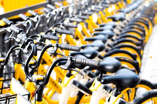December 2019 Guangzhou china rental bikes found along the main street to serve public and connect from area to other. Bicycle parking sign in public park