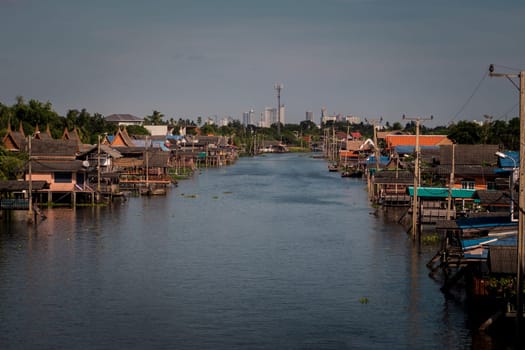 boat for travel in canal, Bangkok Thailand. Community canal in Bangkok Thailand  . Thai traditional houses along canal .Thai lifestyle .travel destination