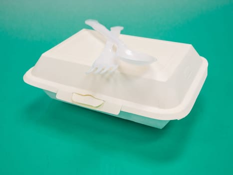 Thai food, stir fried crispy pork basil in foam box.