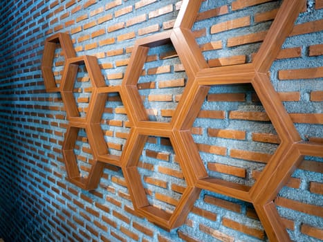 Shelves made of hexagonal wood on vintage wall