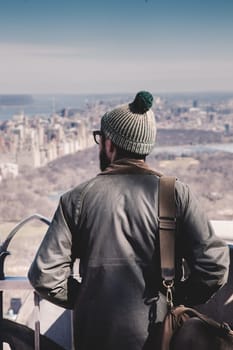 Tourist enjoying in New York City panoramic view . Central park seen from observation deck.