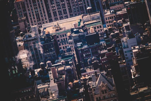 New York City, USA. Midtown Manhattan building rooftops with steam comming from the heating systems.