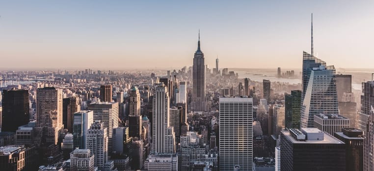 Panoramic view of New York City. Manhattan downtown skyline with Empire State Building and skyscrapers.