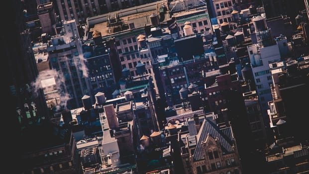 New York City, USA. Midtown Manhattan building rooftops with steam comming from the heating systems.
