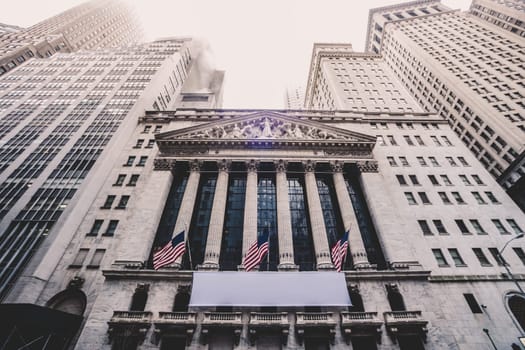 Exterior of New york Stock Exchange, largest stock exchange in world by market capitalization and most powerful global financial institute. Wall street, lower Manhattan, New York City, USA.