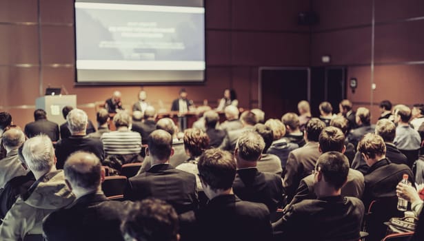 Round table discussion at business convention and presentation. Audience at the conference hall. Business and entrepreneurship symposium.