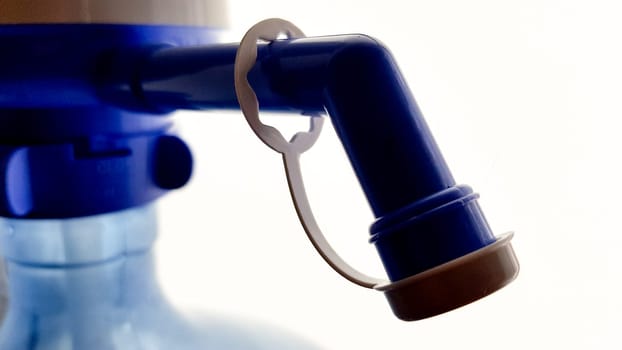 pump on a water bottle. Close-up on a white background.