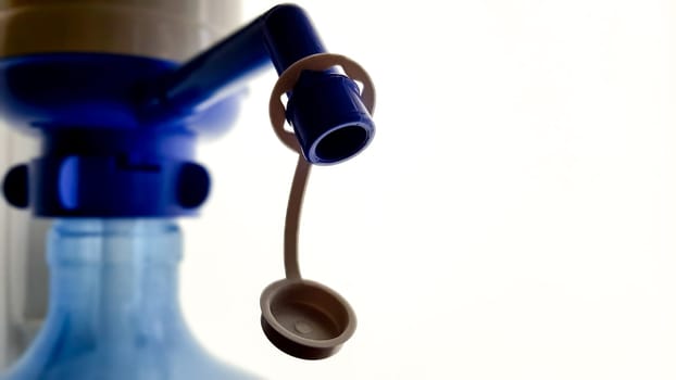 pump on a water bottle. Close-up on a white background.