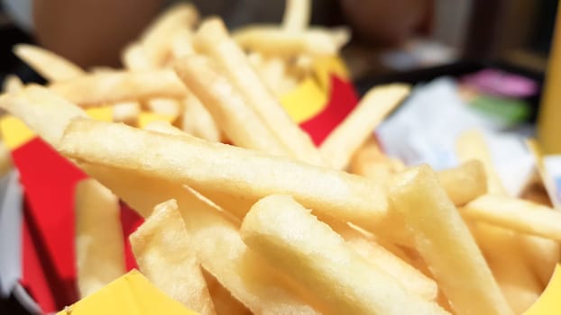 Ukraine, Kiev - September 1, 2019: french fries and hamburger in a fast food restaurant. Not healthy food on the table.