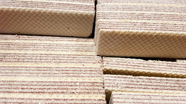 Close-up of yellow and brown waffles stuffed to a box.