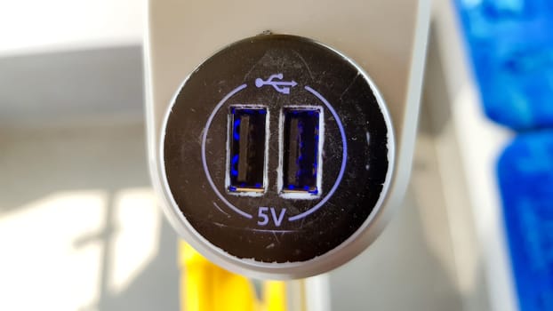 USB sockets in a tram car. USB port in a passenger carriage in Europe for charging gadgets and electronics.
