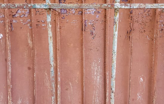 Texture of the old concrete wall for background. Reinforced concrete with damaged and rusty metal fittings.