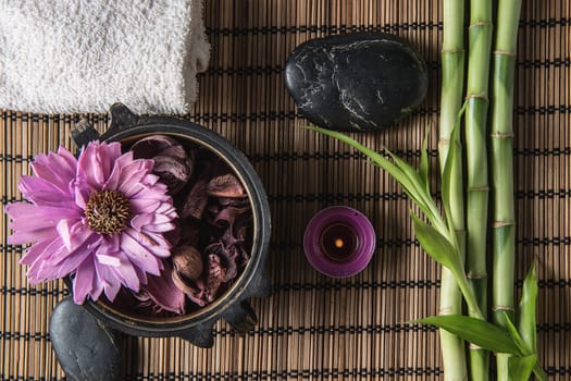 spa still life with zen basalt stones ,votive candle and  bamboo