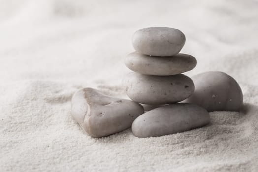 zen basalt stones  on the sand