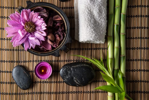 spa still life with zen basalt stones ,votive candle and  bamboo