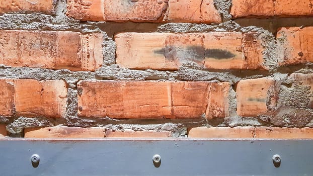 Vintage brick wall background. The red clay brick is beautiful, strong,suitable for decoration as a folk wall, used as a background image