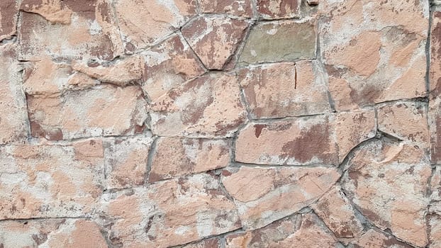 Gray stone wall background. The texture of the stone. Old castle wall background. Stone wall as a background or texture. Part of the wall, for background or texture